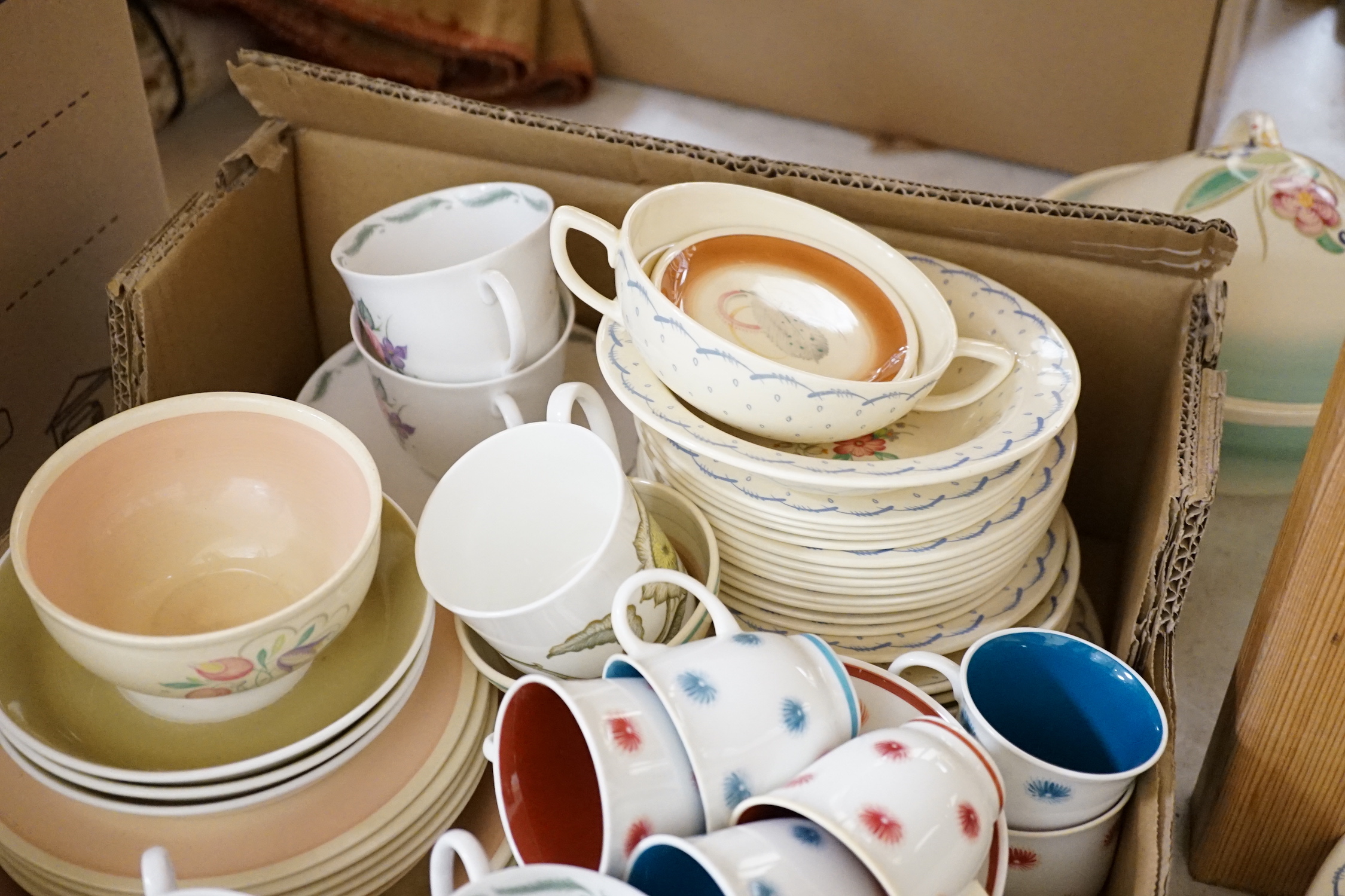 A collection of Susie Cooper ceramics and tablewares including tureens, an oval platter, cups and saucers